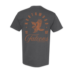 A dark gray t-shirt shown from the back, featuring a distressed orange graphic print of an eagle, the text 'NORTHWOOD', 'FalconeS', and '1967' on a solid white background.