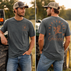 A man wearing a dark gray crewneck t-shirt with a brown graphic on the left chest and a large back print reading 'Northwood Falcons' with an eagle design, paired with a tan and brown baseball cap and blue jeans, shown in a split front and back view.
